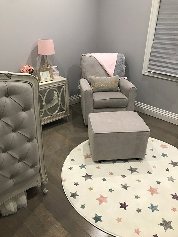 Nursery with round store rug